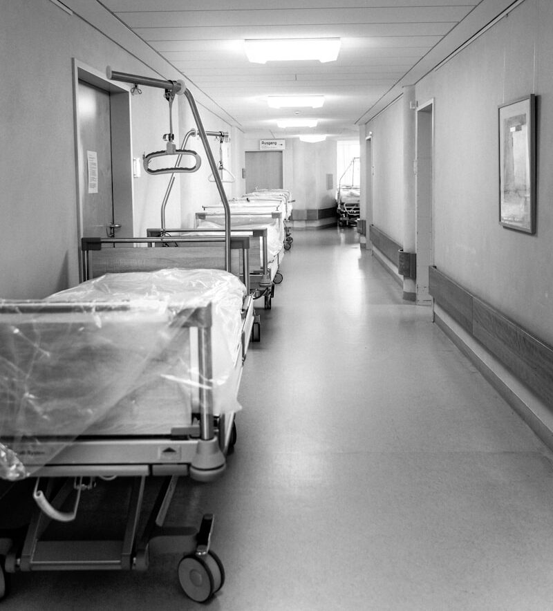 white hospital bed in a room
